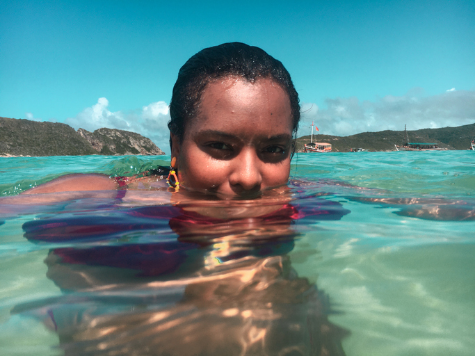 Portrait Of Woman Swimming In Sea