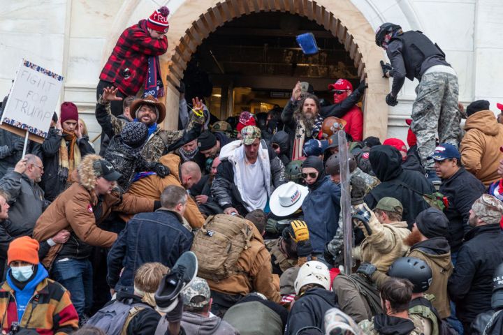 Rioters clash with police trying to enter Capitol building...