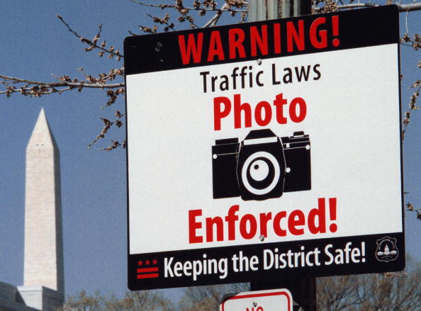 SLUG: ME/REDLIGHT Sign warning motorists of red light enfor