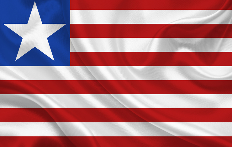 Liberia country flag on wavy silk fabric background panorama