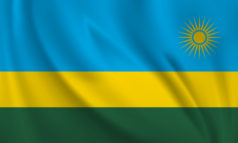 Waving flag of Rwanda blowing in the wind. Full page flying flag